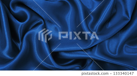Smooth elegant blue silk or satin luxury texture as abstract background. Luxurious Christmas background or New Year background design Smooth elegant blue silk or satin luxury texture as abstract background. Luxurious Christmas background or New Year background design 133340147