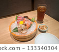 Assorted salmon, sea bream, and squid sashimi in a bucket 02 133340304
