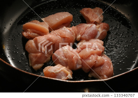 Grilling chicken thighs 133340707