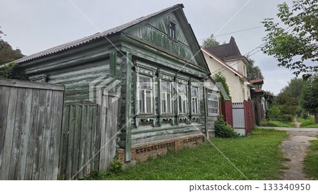 Traditional wooden house in Pavlovsky Posad, Russia: rustic architecture and countryside ambiance Traditional wooden house in Pavlovsky Posad, Russia: rustic architecture and countryside ambiance 133340950