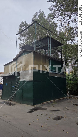 Dovecote in Moscow district. Urban structure with metal framework and trees in Moscow autumn setting 133340983
