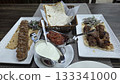 Traditional georgian cuisine display with shaslik, kebab, and sauces for culinary enjoyment 133341000
