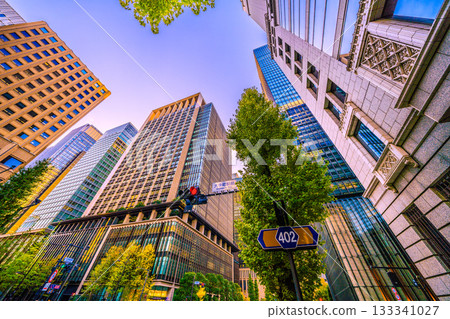 Tokyo cityscape, Japan, November 19th. The setting sun is reflected in the sky. The Taisei Otemachi Building (top right) can be seen from Otemachi Station. 133341027
