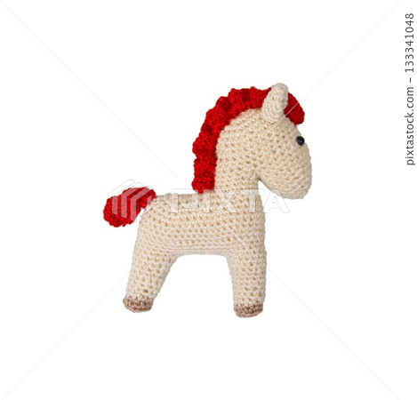 Crocheted toy fiery red horse isolated on a transparent background. The symbol of the year 2026. Crocheted toy fiery red horse isolated on a transparent background. The symbol of the year 2026. 133341048