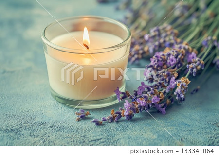 A candle in a glass sits beside a lovely bunch of lavender. AI-generated content. 133341064