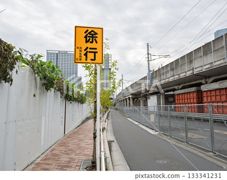 A non-legal warning sign "Slow Down" installed on a narrow road A non-legal warning sign "Slow Down" installed on a narrow road 133341231