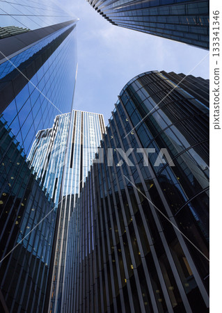 Soaring Glass Skyscrapers in Financial District, Low Angle View Soaring Glass Skyscrapers in Financial District, Low Angle View 133341346