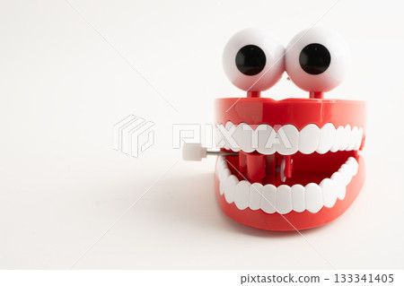 Funny red teeth with eye toy denture model for dental health care. Funny red teeth with eye toy denture model for dental health care. 133341405