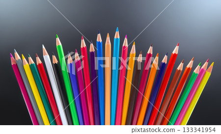 A vibrant row of colored pencils in various shades, standing A vibrant row of colored pencils in various shades, standing 133341954