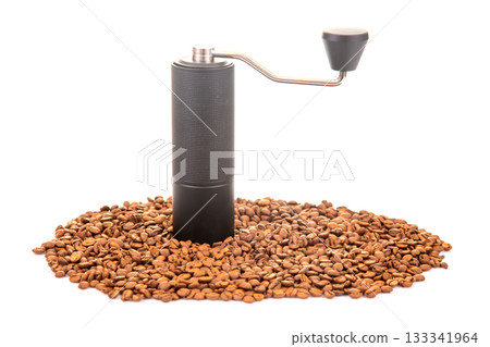 featuring a manual coffee grinder with a metallic handle and a bowl of roasted coffee beans featuring a manual coffee grinder with a metallic handle and a bowl of roasted coffee beans 133341964