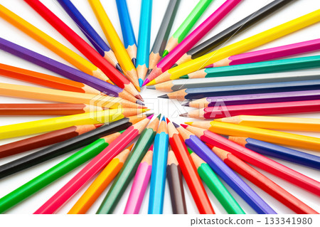 A dynamic array of multicolored pencils radiating outward on a white background 133341980