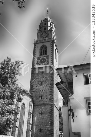 Clocktower of St. Nicholas Church, iconic landmark in Merano, Italy 133342539