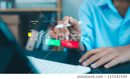 Modern fintech trading interface with hand using digital pen for buy sell investment 133342594