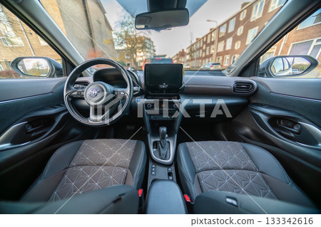 Netherlands - November 2025 : Toyota Yaris Cross interior. Hybrid subcompact crossover SUV produced Toyota. interior design new Toyota Yaris Cross model design inside the cabin. 133342616