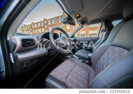 Netherlands - November 2025 : Toyota Yaris Cross interior. Hybrid subcompact crossover SUV produced Toyota. interior design new Toyota Yaris Cross model design inside the cabin. 133342618