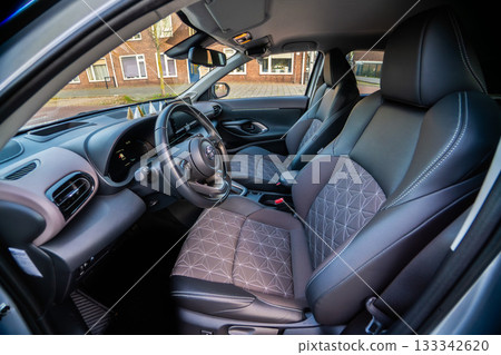 Netherlands - November 2025 : Toyota Yaris Cross interior. Hybrid subcompact crossover SUV produced Toyota. interior design new Toyota Yaris Cross model design inside the cabin. 133342620