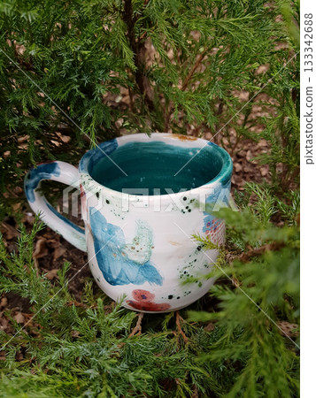 Handmade Glazed Mug: Artistic Pottery Among Greenery Handmade Glazed Mug: Artistic Pottery Among Greenery 133342688