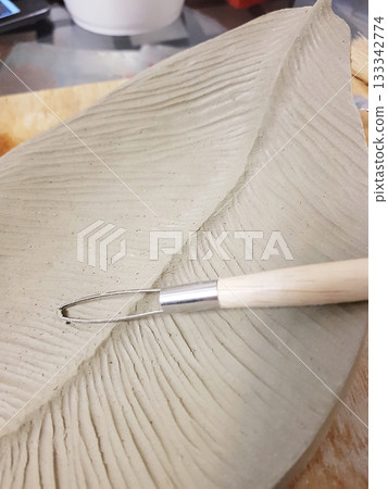 Creating a Detailed Clay Leaf Sculpture with Tools Creating a Detailed Clay Leaf Sculpture with Tools 133342774