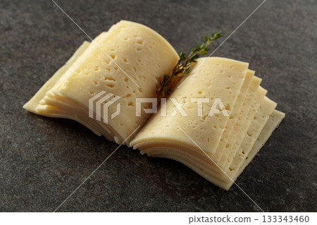 Cheese slices folded like an open book. Cheese slices folded like an open book. 133343460