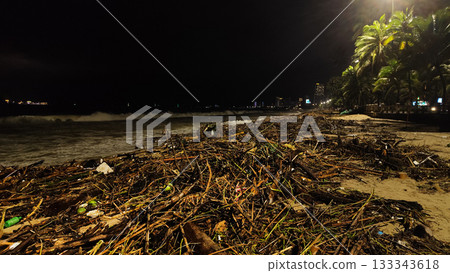 Nha Trang beach covered with storm debris during rainy season 133343618