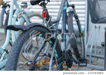 blue bicycle parking on parking lot blue bicycle parking on parking lot 133343963