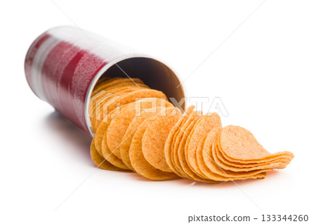 Crispy potato chips isolated on white background. Crispy potato chips isolated on white background. 133344260