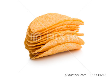 Crispy potato chips isolated on white background. Crispy potato chips isolated on white background. 133344265