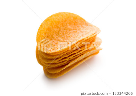 Crispy potato chips isolated on white background. Crispy potato chips isolated on white background. 133344266