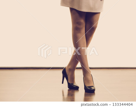 Unrecognizable woman wearing high heels 133344404