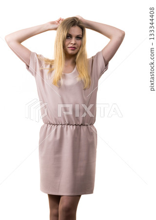 Female wearing casual pink tunic dress 133344408