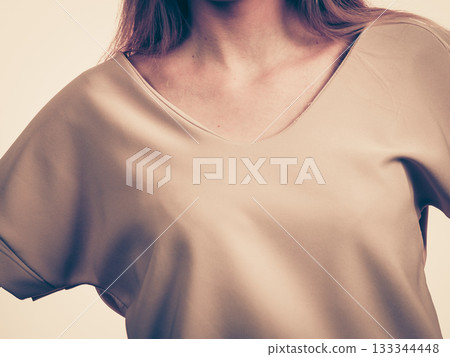Woman wearing casual pink top Woman wearing casual pink top 133344448