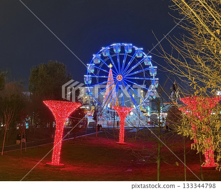 Ferris wheel and illuminated installations set in Luna Park to New Year holidays. Skanderbeg Square, Tirana, Albania Ferris wheel and illuminated installations set in Luna Park to New Year holidays. Skanderbeg Square, Tirana, Albania 133344798