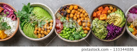 Five colorful vegan bowls feature fresh veggies, celebrating the vegetarian lifestyle this January 133344886