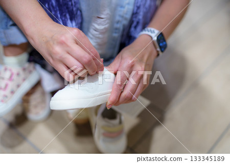 woman cleaning her hands with sponge woman cleaning her hands with sponge 133345189