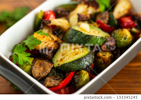 Homemade roasted vegetable mix with zucchini and mushrooms 133345245