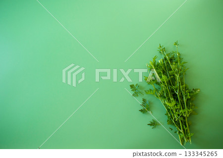 Organic green parsley in a bunch close-up Organic green parsley in a bunch close-up 133345265