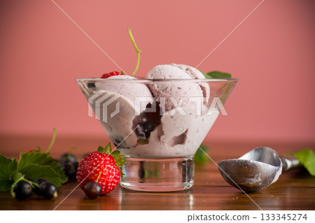 Summer cold dessert with strawberries and blackcurrants isolated Summer cold dessert with strawberries and blackcurrants isolated 133345274