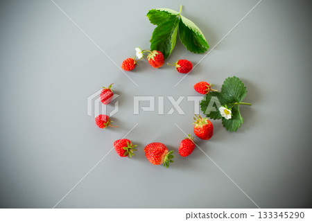 Appetizing red strawberries in a minimalistic composition Appetizing red strawberries in a minimalistic composition 133345290