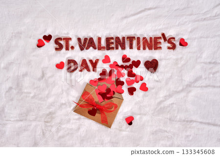 Festive St. Valentine's Day background on a white plush background with hearts. Festive St. Valentine's Day background on a white plush background with hearts. 133345608