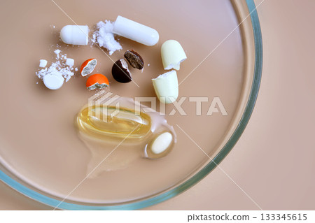Drug analysis with broken capsules on petri dish Drug analysis with broken capsules on petri dish 133345615