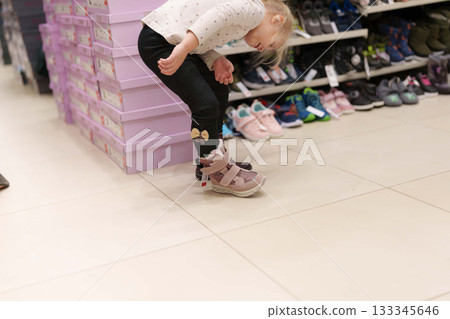 woman in shoes shop 133345646