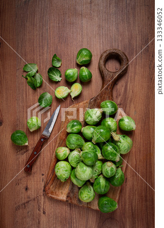 fresh Brussels sprouts, raw, top view, on a wooden table, no people, 133346052