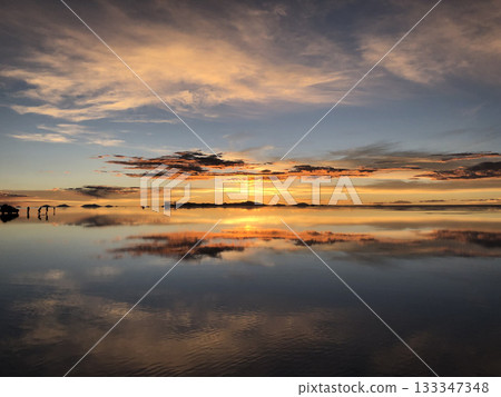 Bolivia: Uyuni Salt Flats dyed in the morning glow Bolivia: Uyuni Salt Flats dyed in the morning glow 133347348