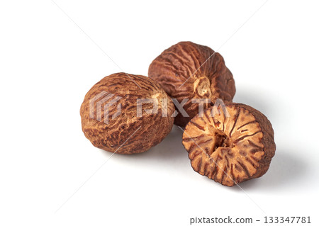 aromatic dried nutmeg isolated on white background. aromatic dried nutmeg isolated on white background. 133347781