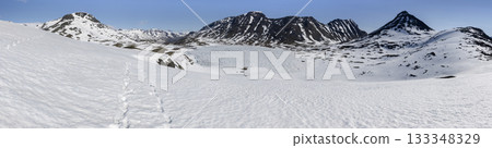 Snowy Leirdalen mountain landscape with clear blue sky 133348329