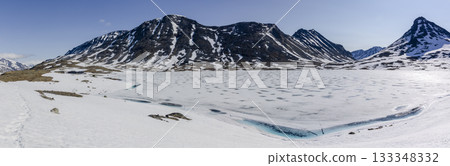 Snowy Leirdalen mountain landscape with clear blue sky 133348332
