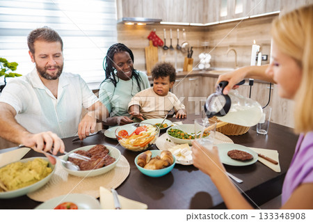 Family gathered for a hearty dinner together 133348908