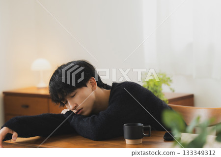 Young man relaxing in the room 133349312