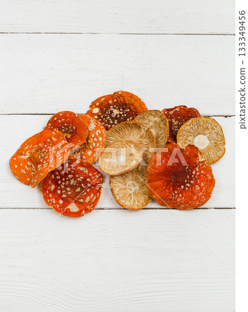 Dried fly agaric on a white background. Dried fly agaric on a white background. 133349456