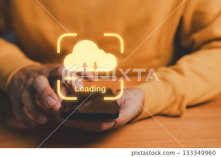 Cloud storage concept with smartphone showing loading bar, symbolizing data upload and download, online backup, digital technology, mobile connection, file transfer, and modern computing. Cloud storage concept with smartphone showing loading bar, symbolizing data upload and download, online backup, digital technology, mobile connection, file transfer, and modern computing. 133349960